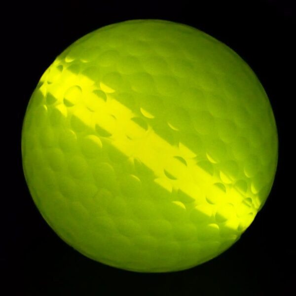 A close up of a ball with yellow light