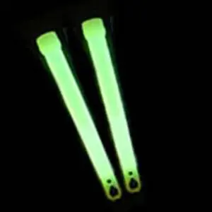 A pair of glow sticks in the dark.