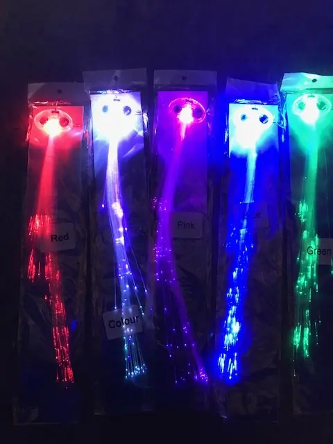 A group of five different colored lights in front of each other.