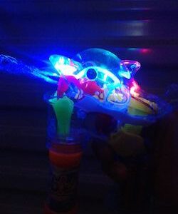 A toy gun with lights on it.