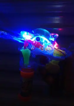 A toy gun with lights on it.