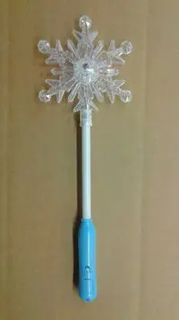 A toothbrush with a blue handle and a white snowflake.