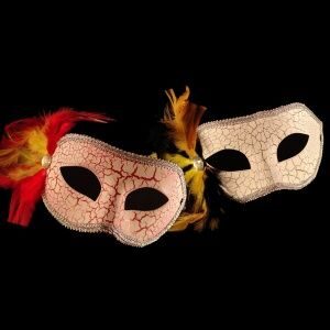 Two masks are sitting on a black background.