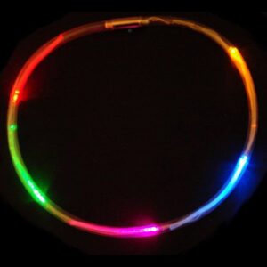 A neon light up hula hoop in the dark.