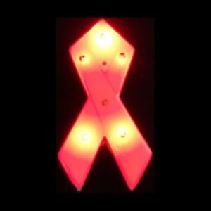 A red ribbon light up sign on a black background