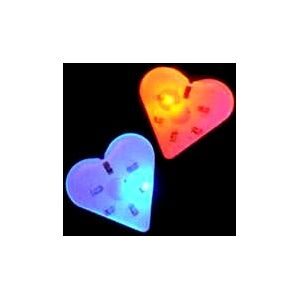 A heart shaped light up pin with two different colors.