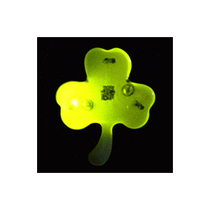 A neon green shamrock with some kind of black background