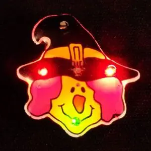 A light up witch face is on display.