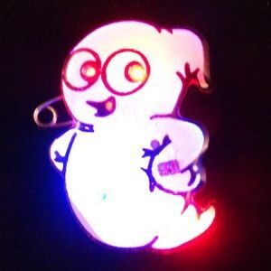 A glowing ghost with red eyes and a blue light.