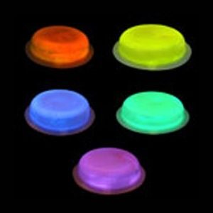 A group of five neon colored plastic lids.