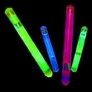 A group of glow sticks that are in the dark.