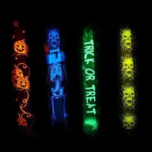 A group of four glow sticks with different designs.