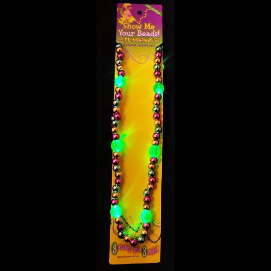 A green light up necklace in the package.